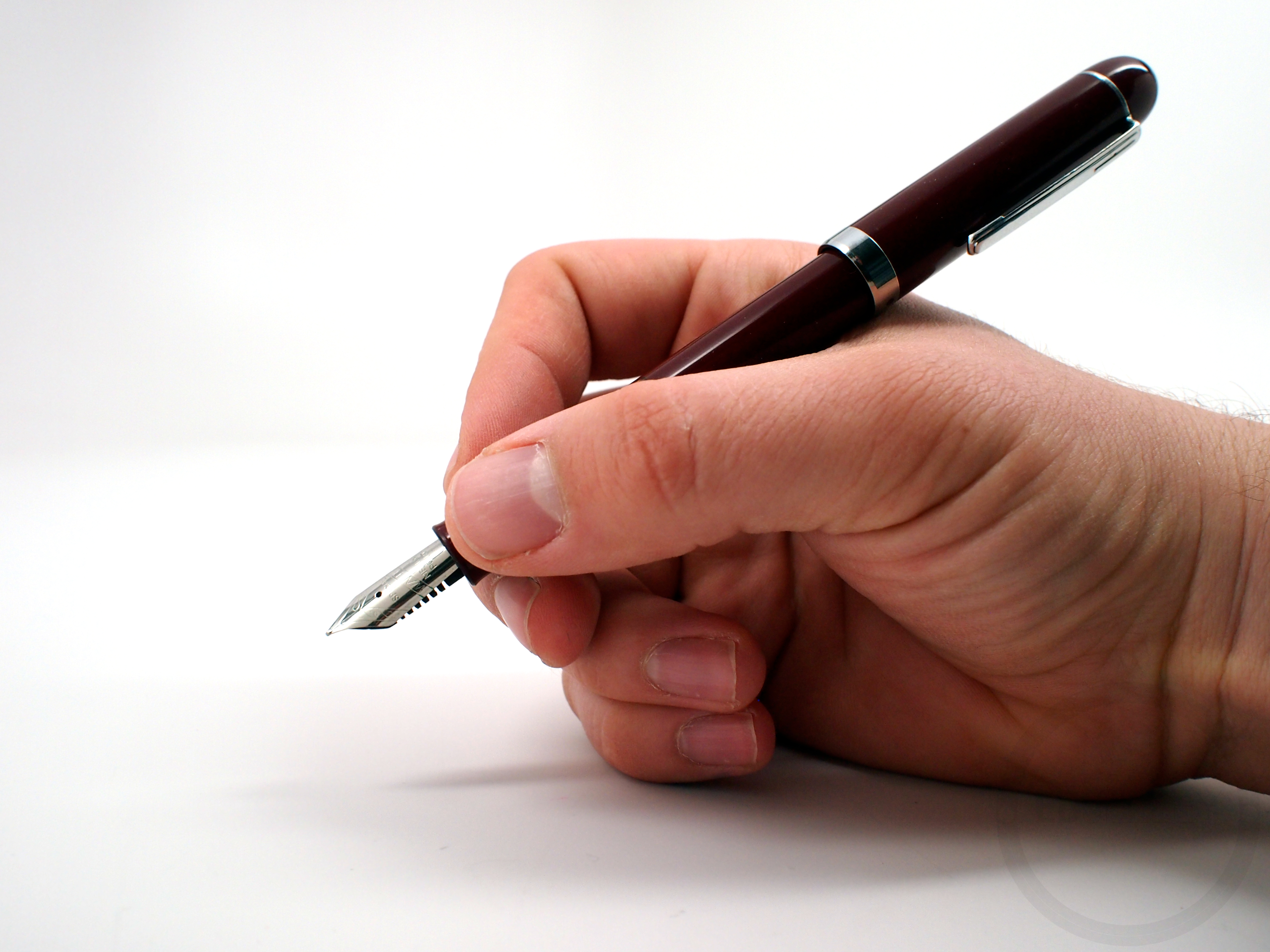 Written with a pen. Hand with Pen. Writing Pen. Hand Ballpoint Pen. Hand with Pen writing.